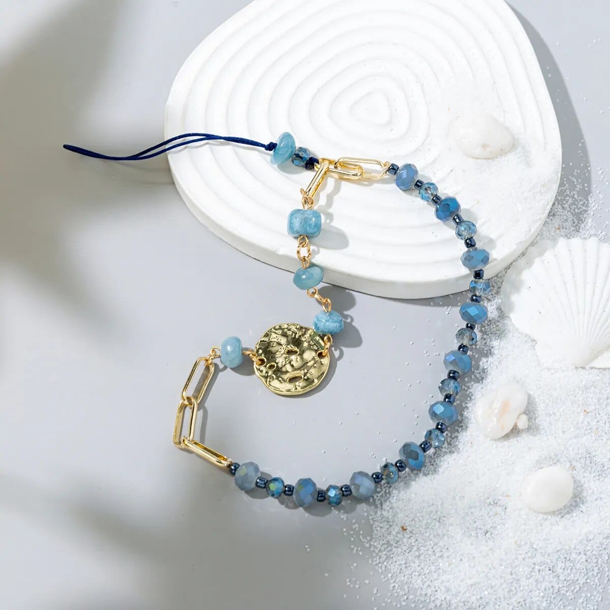 Blaue Perlen-Handykette mit Goldmedaille