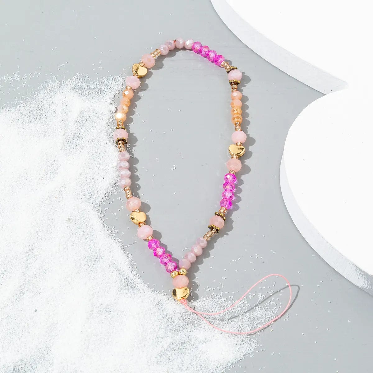 Rosa Perlen Handykette mit goldenen Herzen