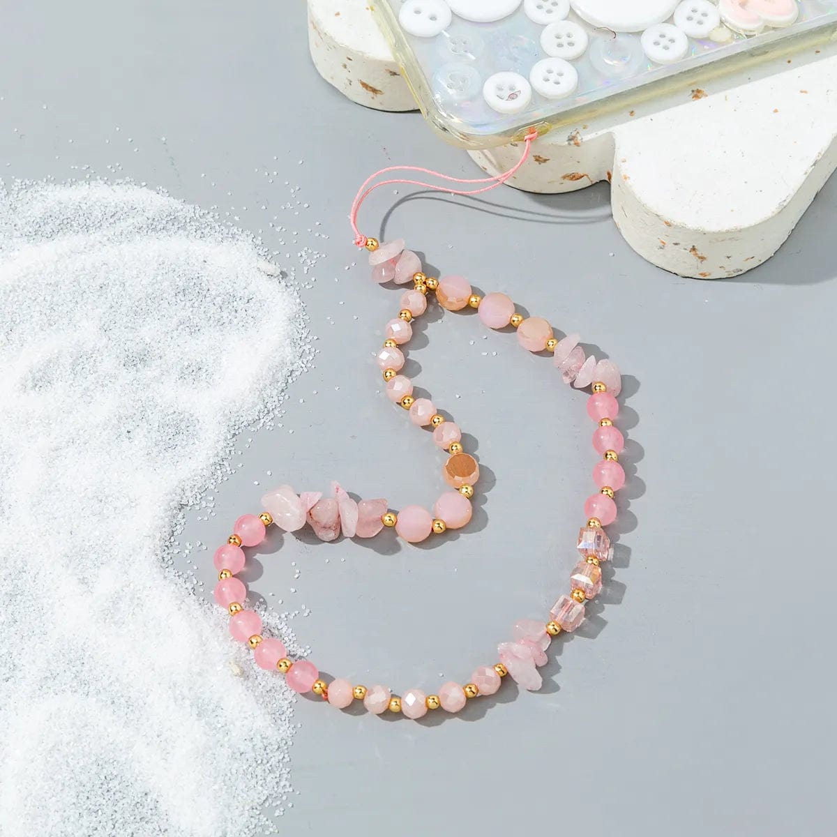 Rosa Perlen-Handykette mit rosa Steinen