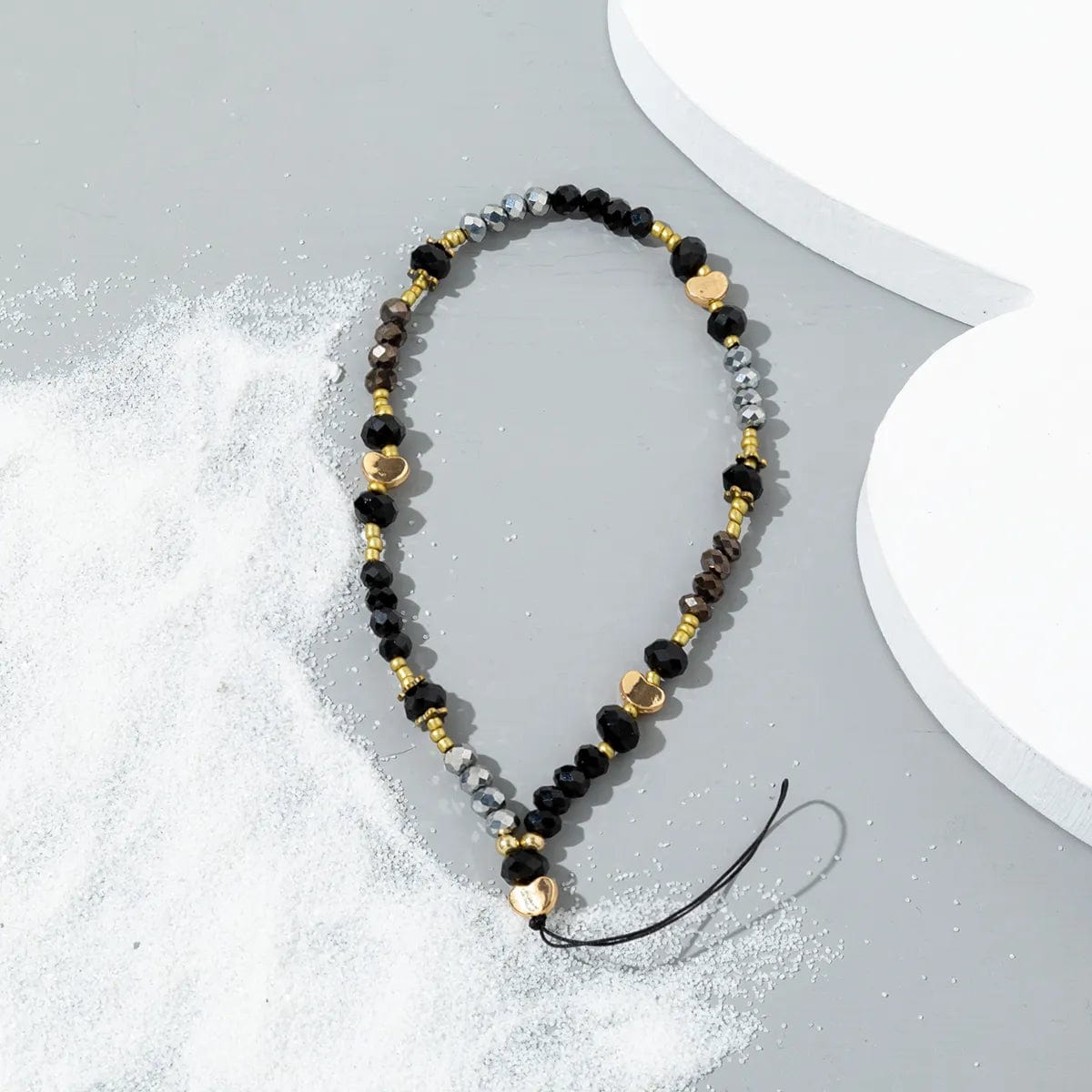 Schwarze und silberne Perlen Handykette mit goldenen Herzen