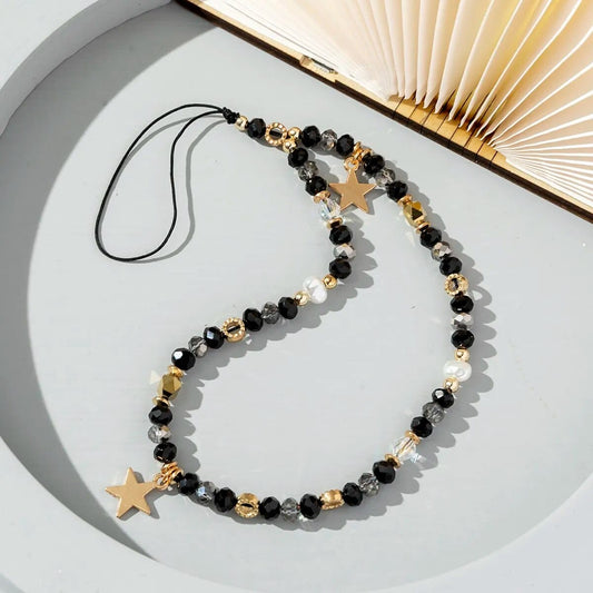 Schwarze und silberne Perlen Handykette mit goldenen Sternen